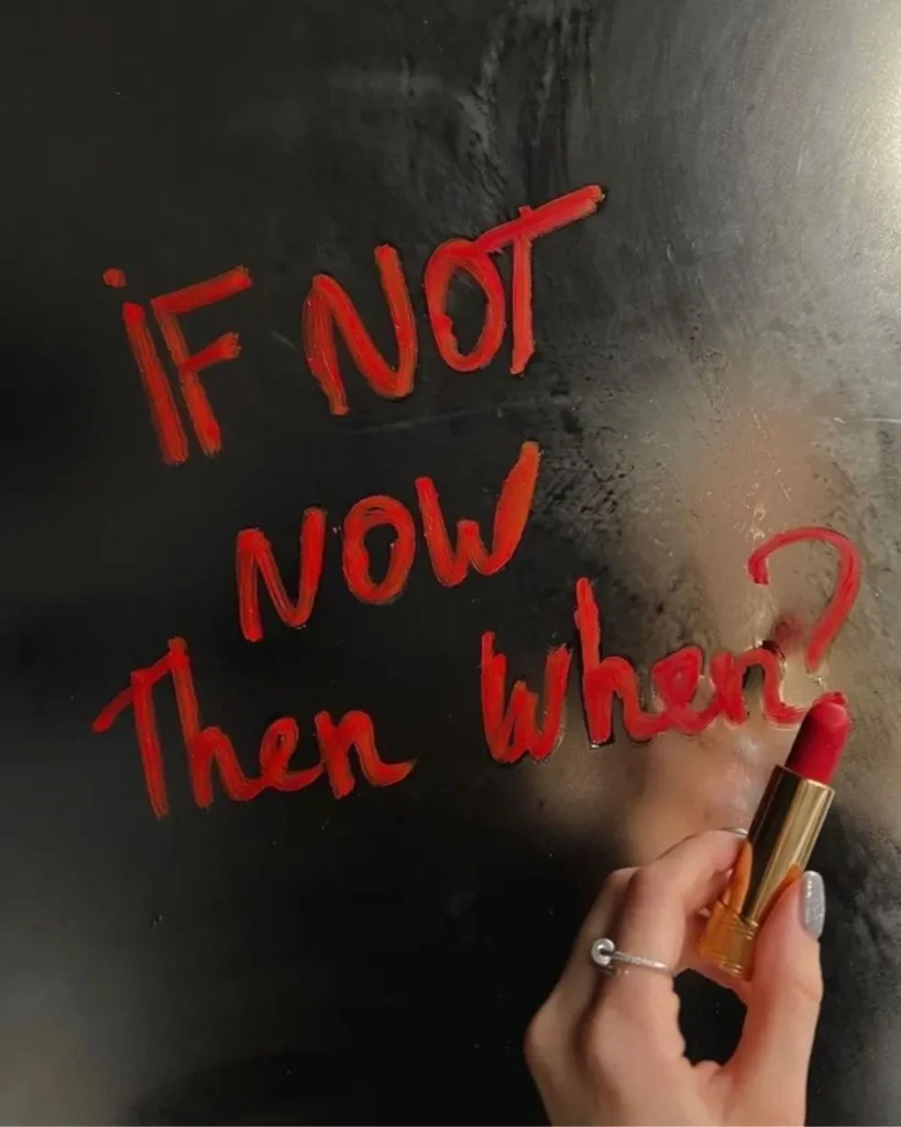 If not now, then when? written in red lipstick on a mirror